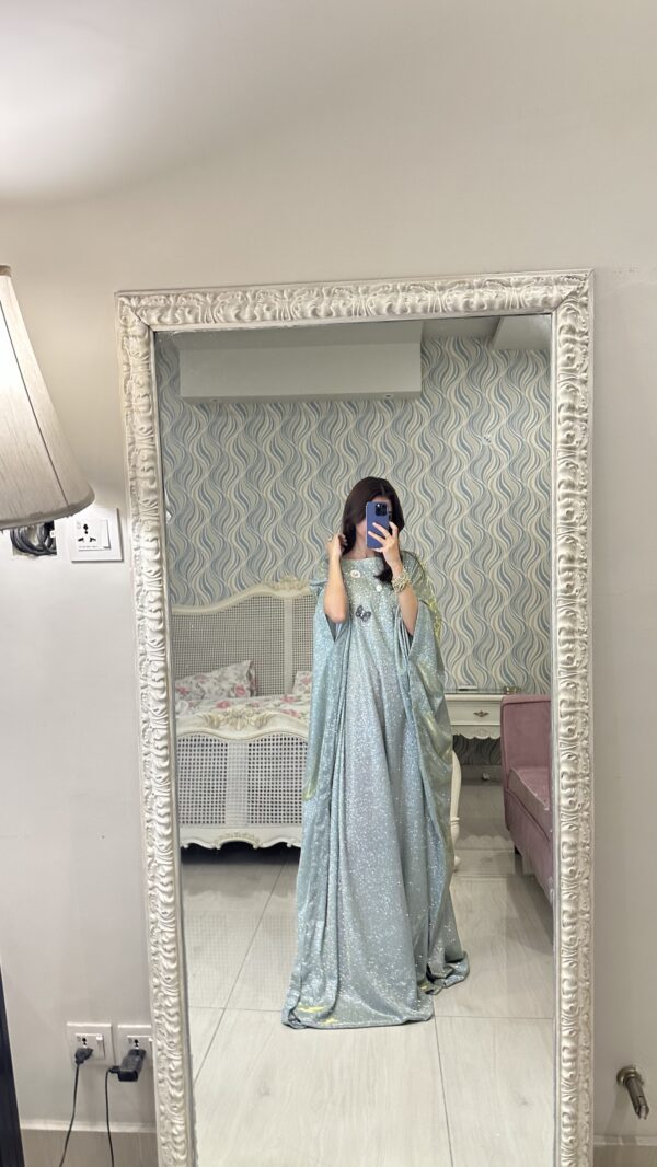 "Luxury glitter butterfly abaya crafted for upscale events, showcasing exquisite modest fashion."